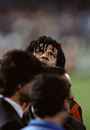 Ruud Gullit glances up at the floodlights