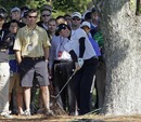 Rory McIlroy hits from behind a tree on the 16th hole 