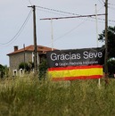 A banner in tribute to Seve Ballesteros greets people upon their arrival in his town ahead of his funeral