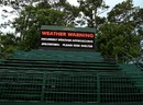A warning sign is seen after play was suspended due to severe storms