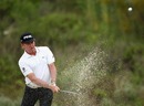 Miguel Angel Jimenez plays out of the second greenside bunker
