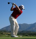 Graeme McDowell hits his tee-shot on the fifth hole