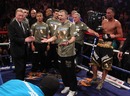 Frank Warren, Jim McDonnell and James DeGale stand dejected 