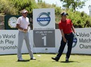 Luke Donald watches his tee-shot on the first hole as Ian Poulter looks on