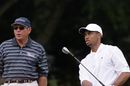 Tiger Woods practices with coach Butch Harmon
