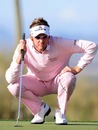 Ian Poulter lines up a putt