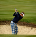 Ian Poulter plays from a bunker