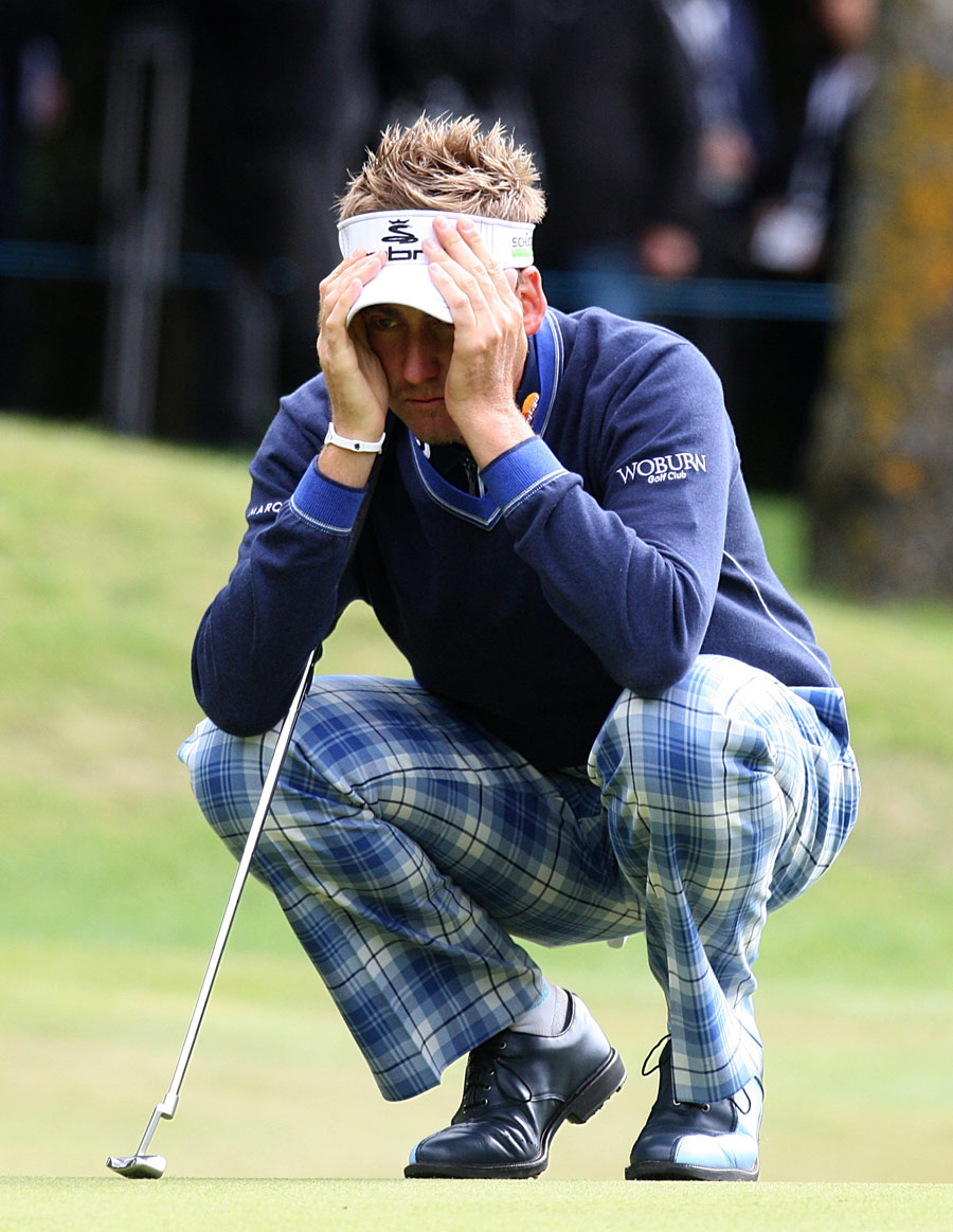 Ian Poulter casts his eye over a putt