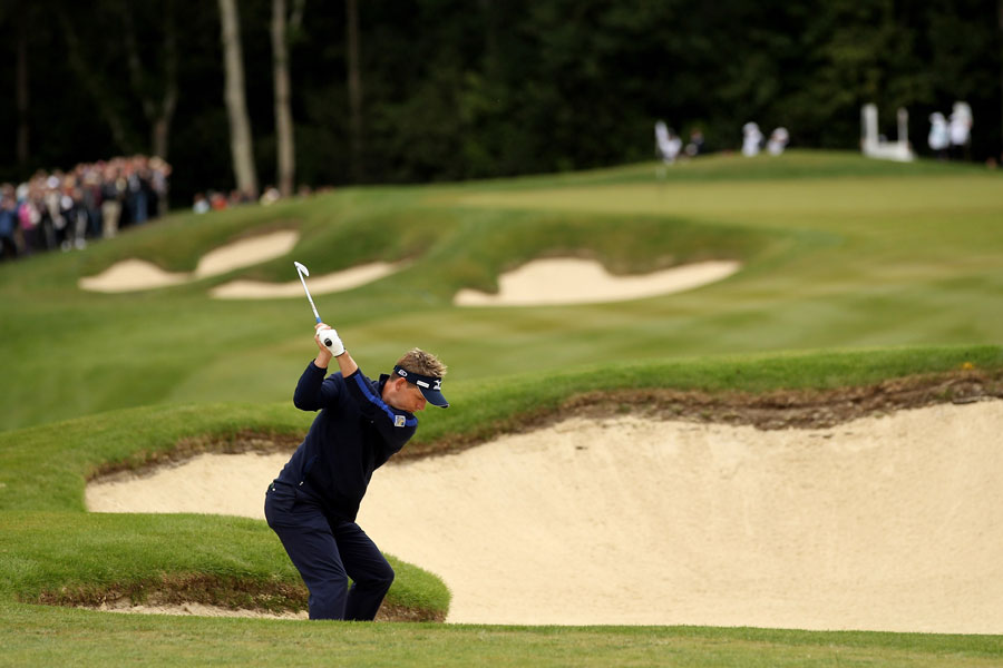 Luke Donald plays from the bunker