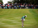 Rory McIlroy pitches towards the green