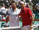 Roger Federer and Stanislas Wawrinka pose for photos
