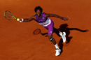 Gael Monfils stretches for the ball