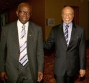 Mohamed bin Hammam is accompanied by Jack Warner during a meeting in Port of Spain