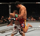Renan Barao fires a flying knee at Cole Escovedo