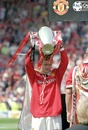 Paul Scholes holds the Premier League trophy aloft