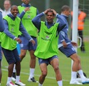 Ashley Cole and Ashley Young react during an England training session
