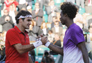 Roger Federer is congratulated by Gael Monfils