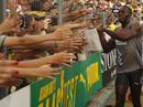 Usain Bolt celebrates after his win in the 100m