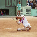 Michael Chang falls to the clay