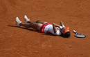Li Na falls to the floor after winning her first grand slam