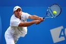 Andy Roddick hits a double-handed backhand
