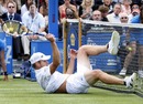 Andy Roddick falls into the net