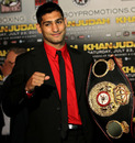 Amir Khan holds his WBA belt ahead of his fight with Zab Judah