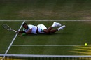 Jo-Wilfried Tsonga dives to return the ball against Rafael Nadal