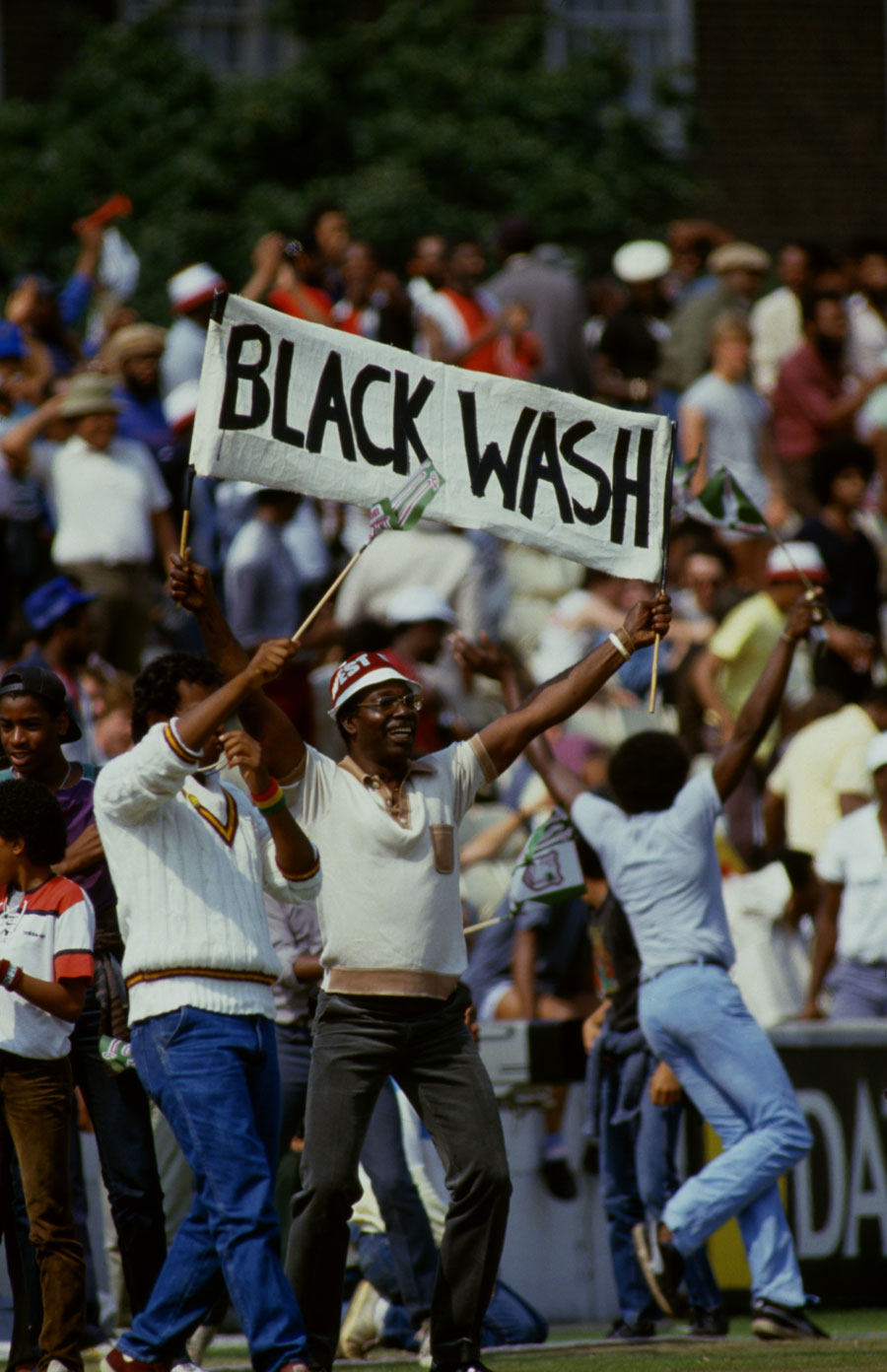 West Indian supporters hold up 