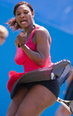 Serena Williams clenches her fist after winning a point