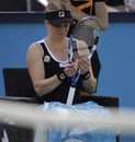 Kim Clijsters pauses in between games against Romina Oprandi