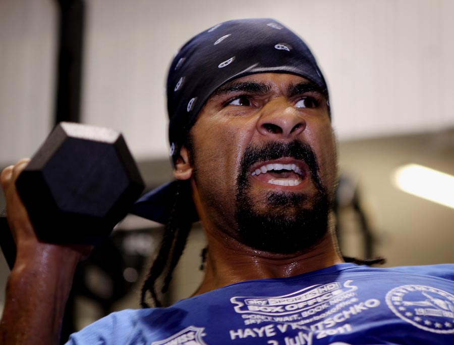 David Haye lifts weights during a media training day