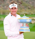 Ian Poulter holds the World Match Play Championship trophy