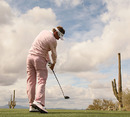 Desert drive: Ian Poulter tees off past the cacti in Arizona