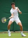 Milos Raonic winds up for a forehand