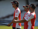 Alastair Cook, flanked by Ian Bell and Jonathan Trott, warms up for the first ODI