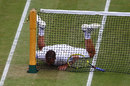 Mikhail Youzhny crashes into the net