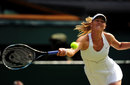 Maria Sharapova stretches to reach a return