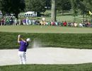 Justin Rose plays from a bunker