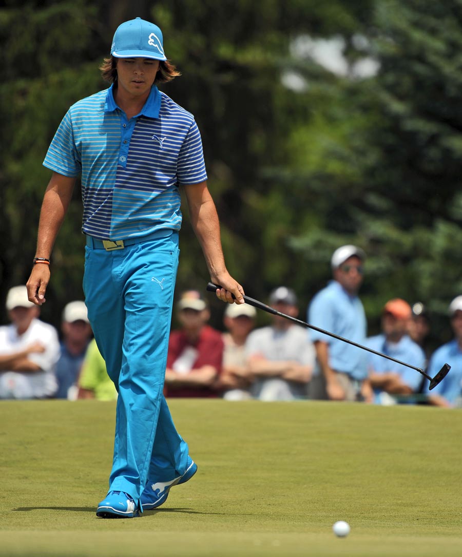 Rickie Fowler reacts to a missed birdie shot on the third hole