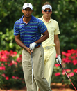 Ian Poulter studies Tiger Woods' drive