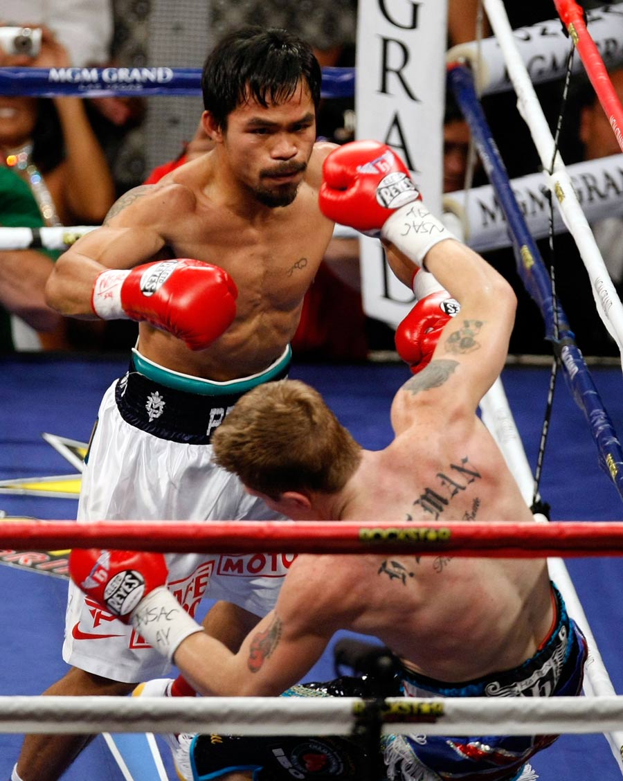 Ricky Hatton falls against the ropes after being hit by Manny Pacquiao