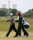 Rory McIlroy and Rickie Fowler chat as they walk down the fairway