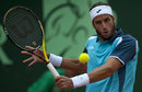 Feliciano Lopez plays a backhand