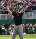 Darren Clarke celebrates after sinking his putt on the 18th 