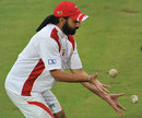 Monty Panesar does some catching practice during a rain delay 
