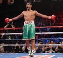Amir Khan celebrates his fifth round knockout of Zab Judah