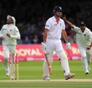 Alastair Cook is caught behind as India's players celebrate