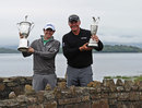 Rory McIlroy and Darren Clarke show off their trophies