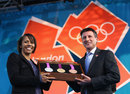 Dame Kelly Holmes and Lord Sebastian Coe show off the new Olympic medals